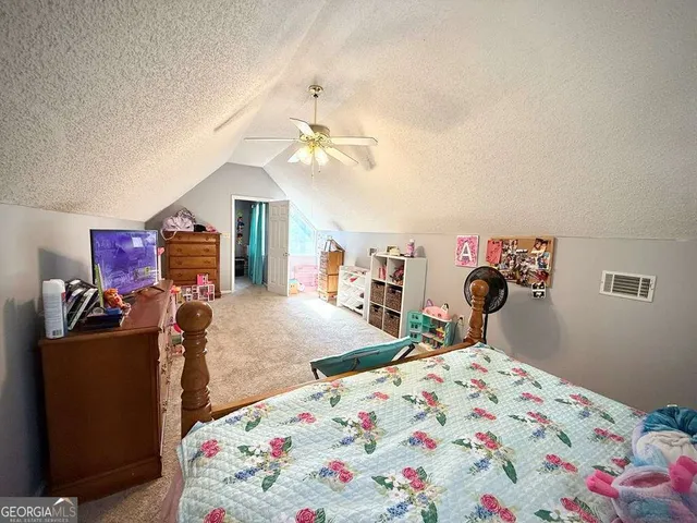 a bathroom with a sink toilet and mirror