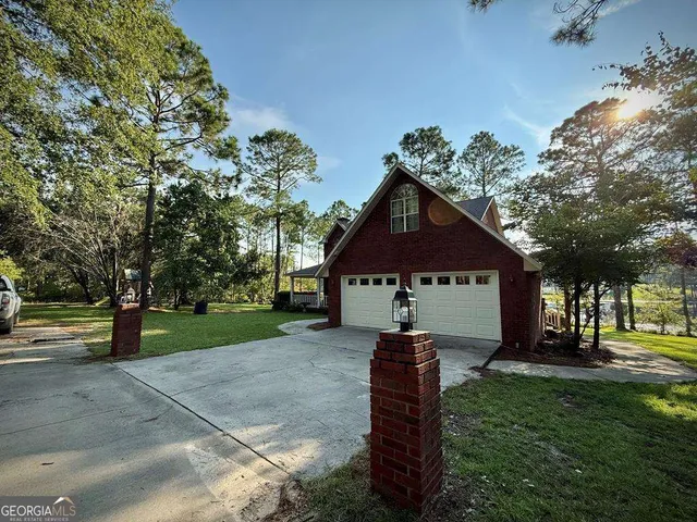 a view of front door with yard