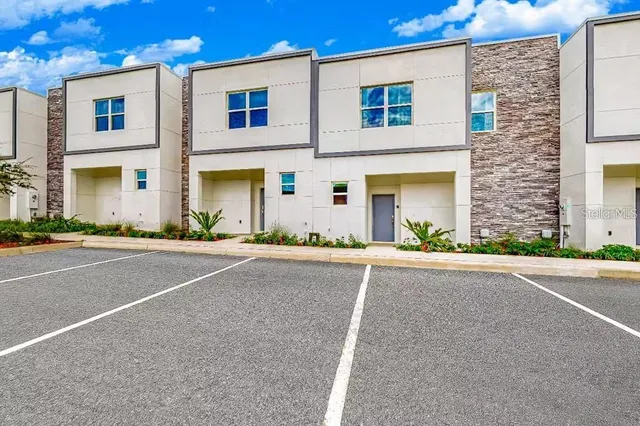 front view of a brick house with a street