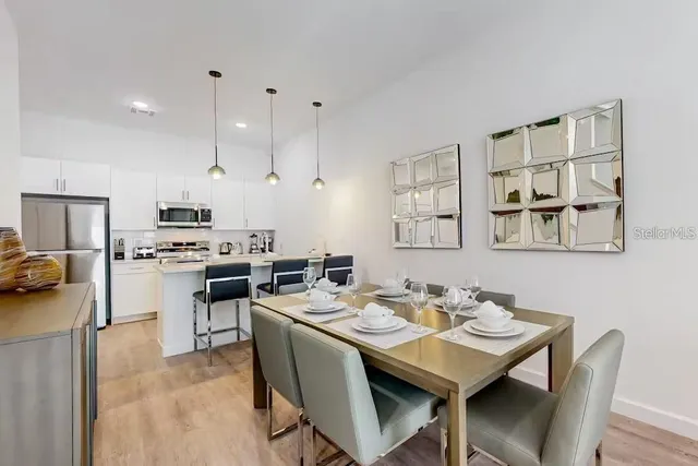 a view of a dining room kitchen and a sink