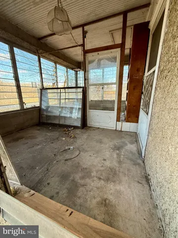 a view of an empty room with a fireplace