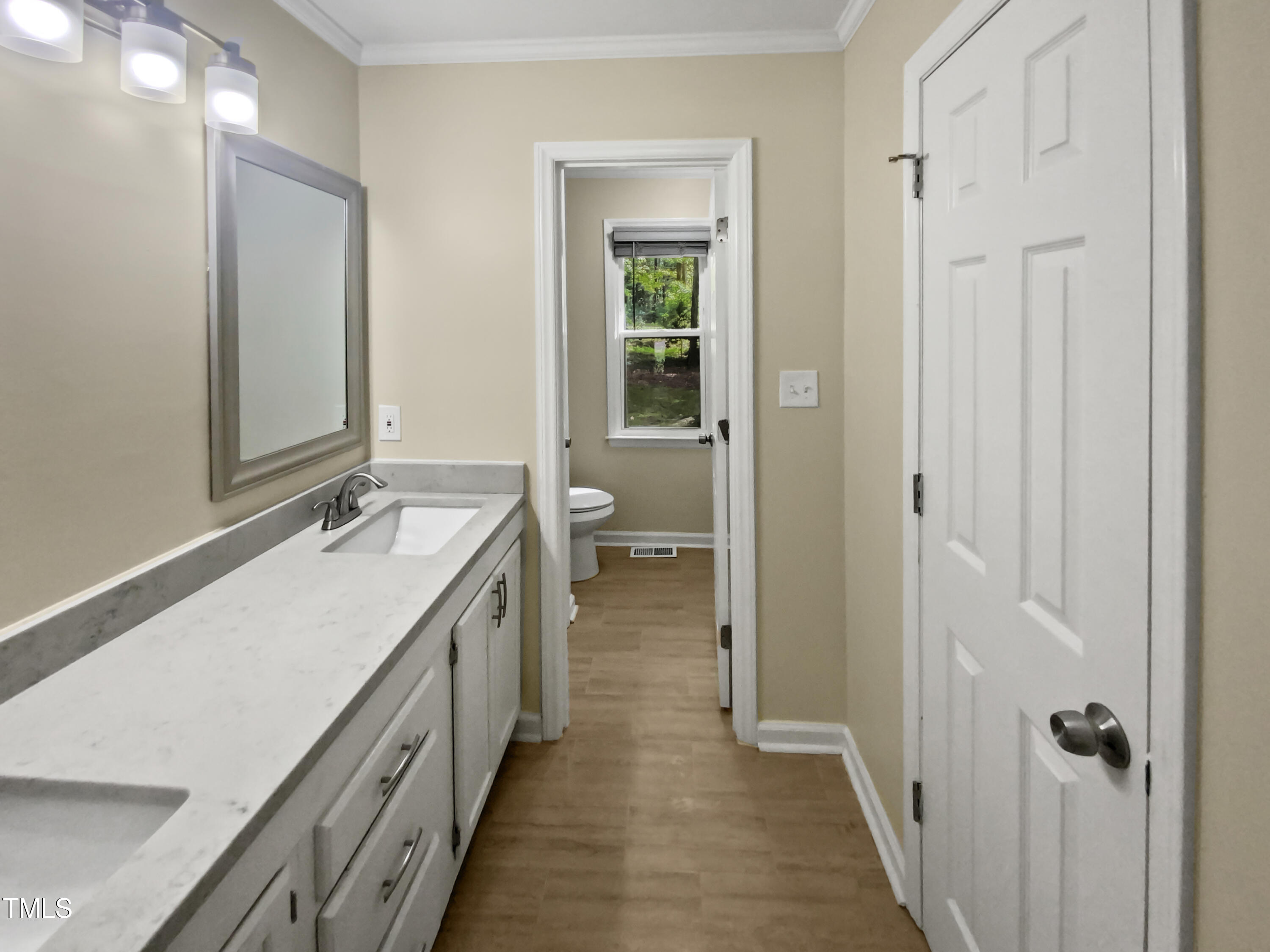 1517 Wiljohn Road Garner, NC 27529 - Photo 5 of 20 a bathroom with a double vanity sink and mirror