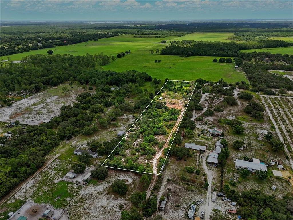 1681 McClellan Road Frostproof, FL 33843 - Photo 11 of 18 a view of a field with an ocean