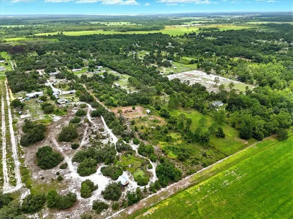 a view of a field with an ocean