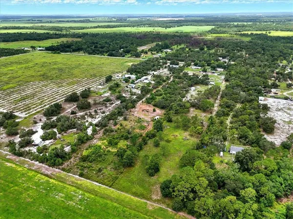 a view of a field with an ocean view