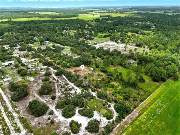 a view of a field with an ocean