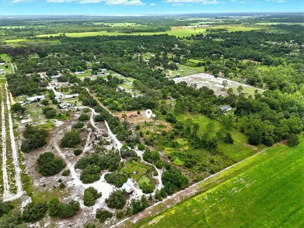 a view of a field with an ocean