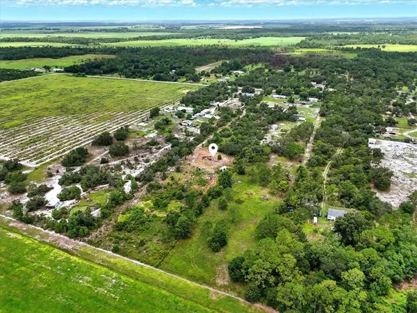 a view of a field with an ocean view