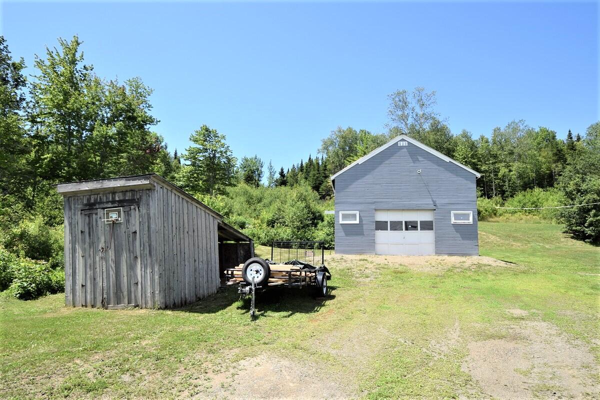 1018 Shin Pond Road Mount Chase, ME 04765 - Photo 9 of 35 Wood storage area on the left...