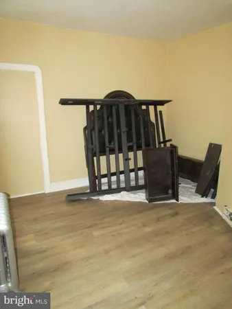 a view of a deck with wooden floor and fence