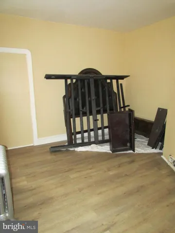 a view of a deck with wooden floor and fence