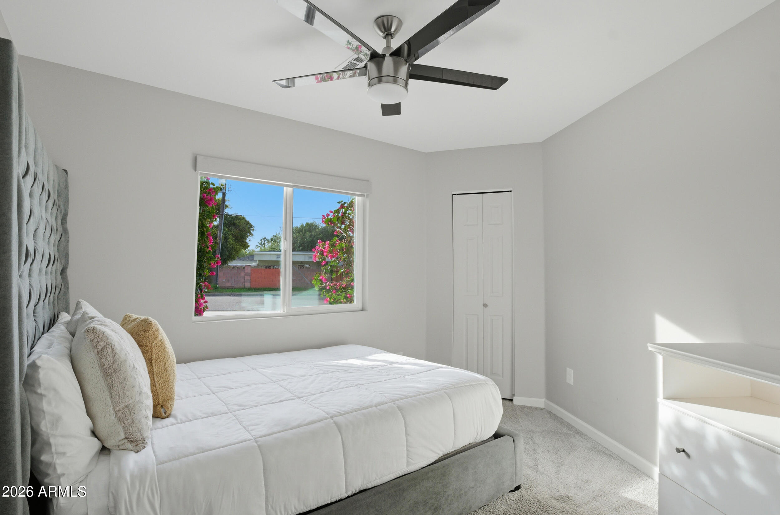1134 East Colter Street Phoenix, AZ 85014 - Photo 15 of 27 a bedroom with a bed and a painting on the wall