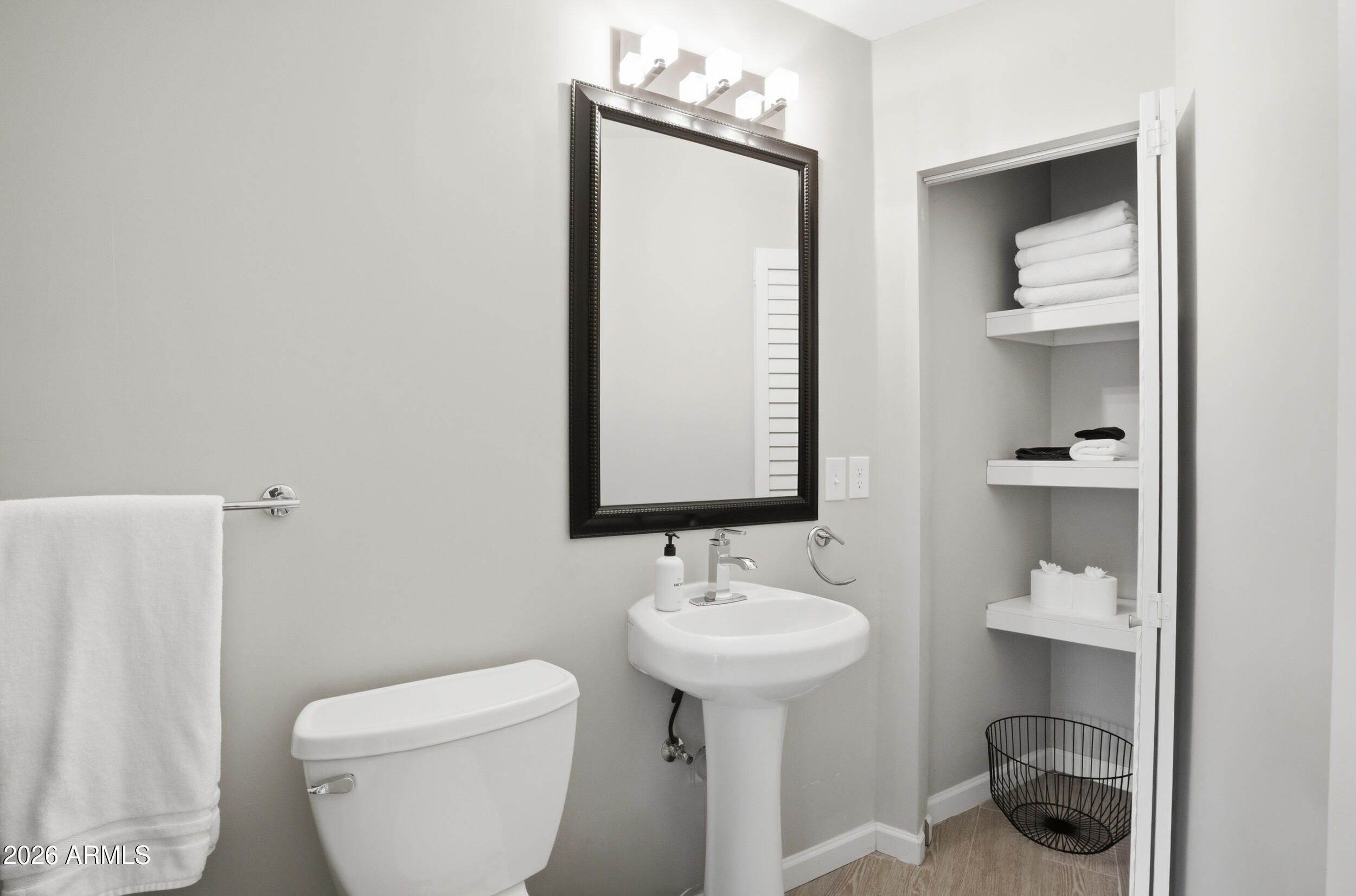 1134 East Colter Street Phoenix, AZ 85014 - Photo 16 of 27 a bathroom with a sink toilet and mirror