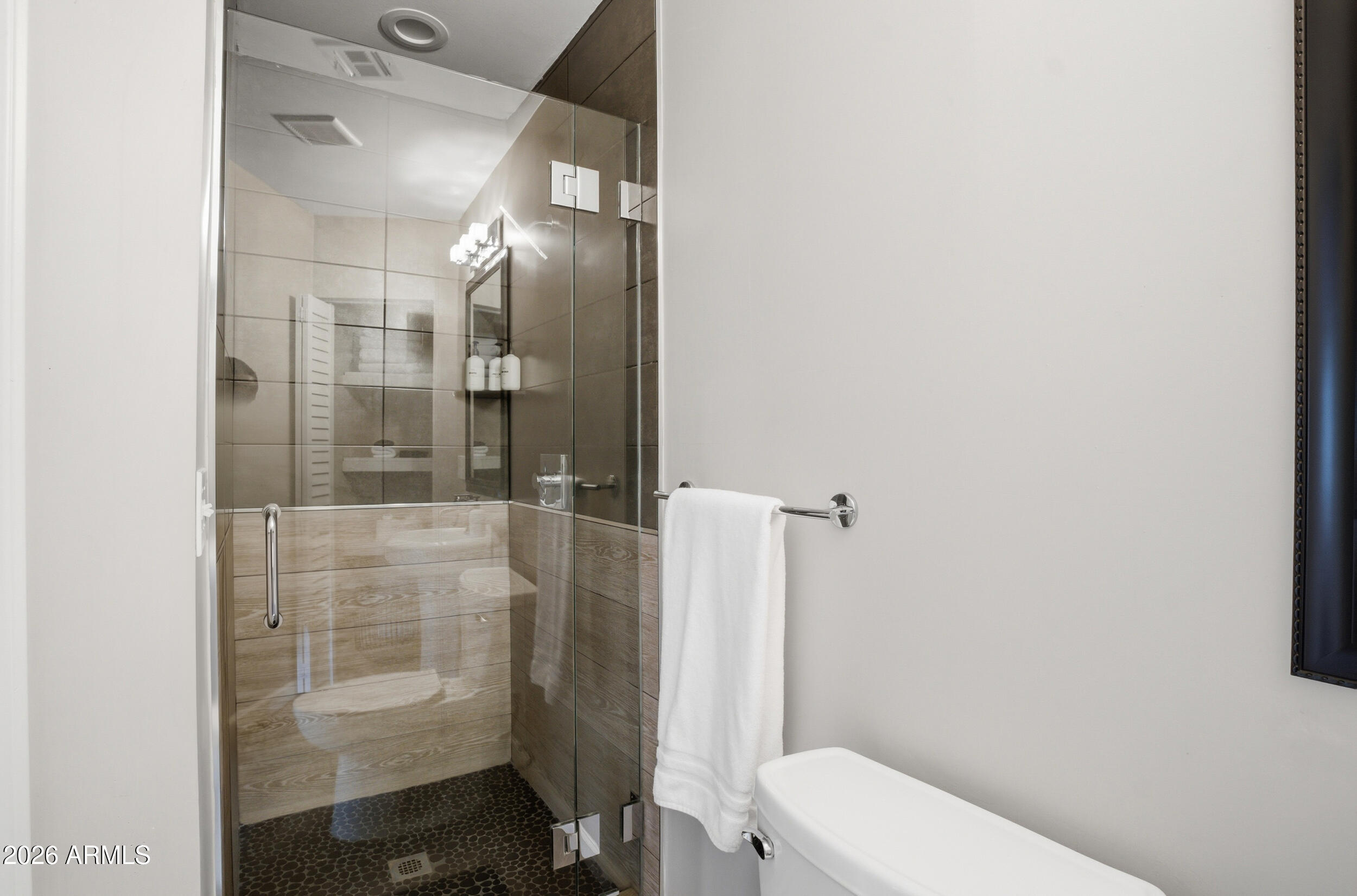 1134 East Colter Street Phoenix, AZ 85014 - Photo 17 of 27 a bathroom with a toilet and a shower