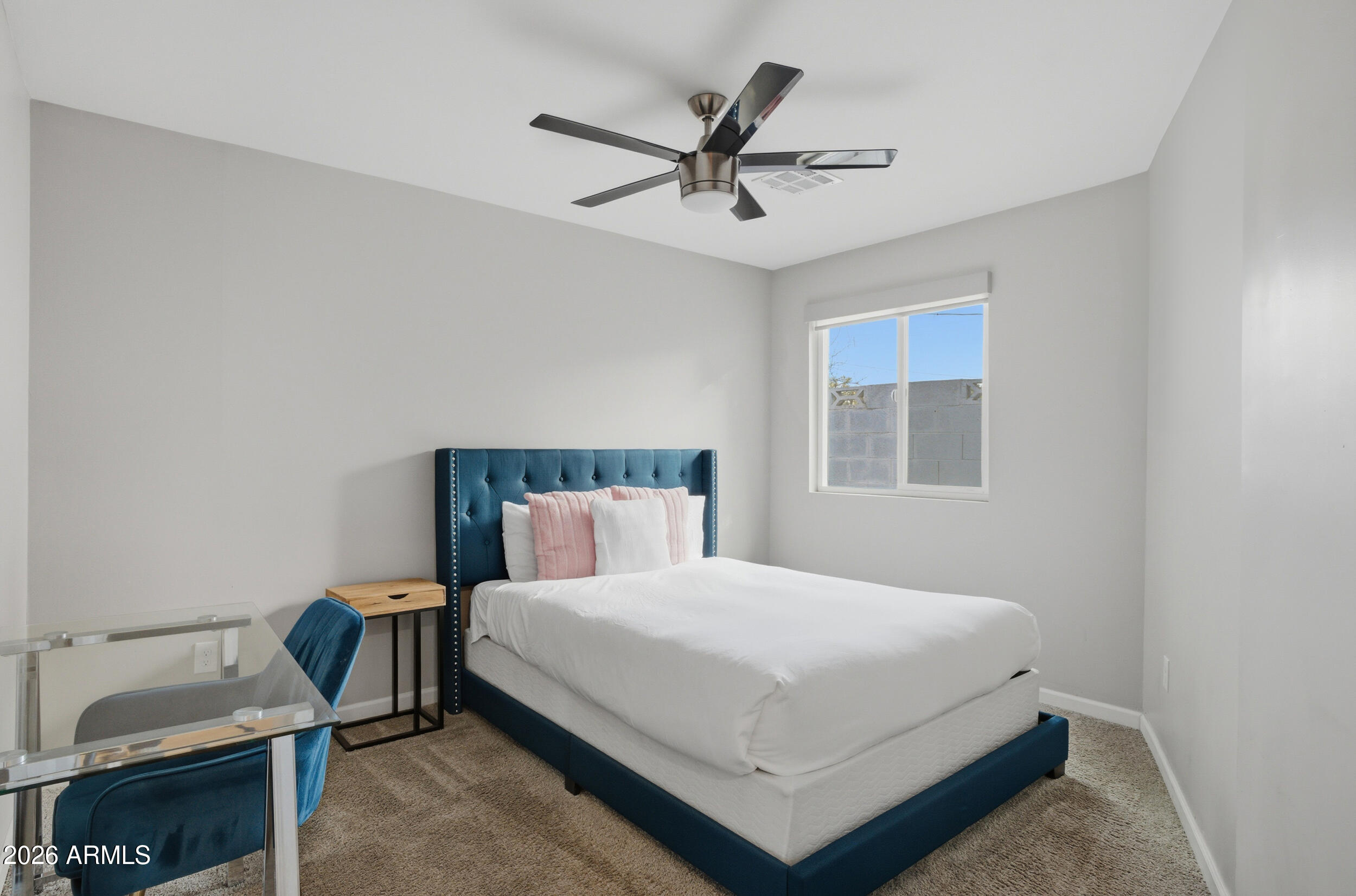 1134 East Colter Street Phoenix, AZ 85014 - Photo 19 of 27 a bedroom with a bed and window