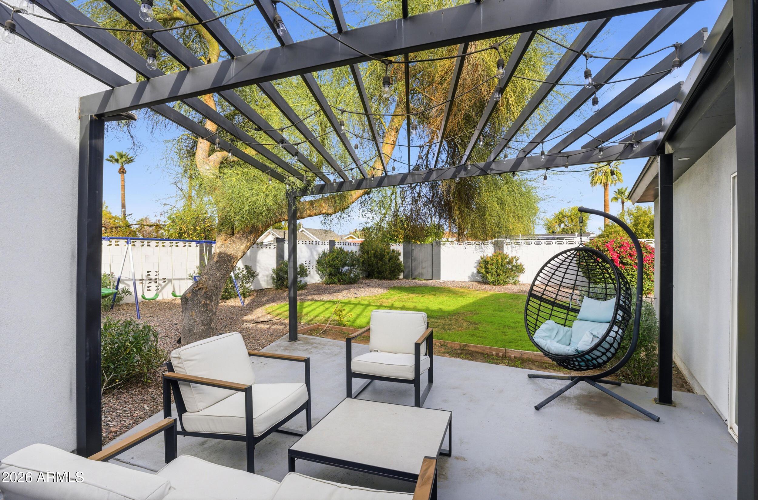1134 East Colter Street Phoenix, AZ 85014 - Photo 23 of 27 a view of swimming pool with outdoor seating and yard