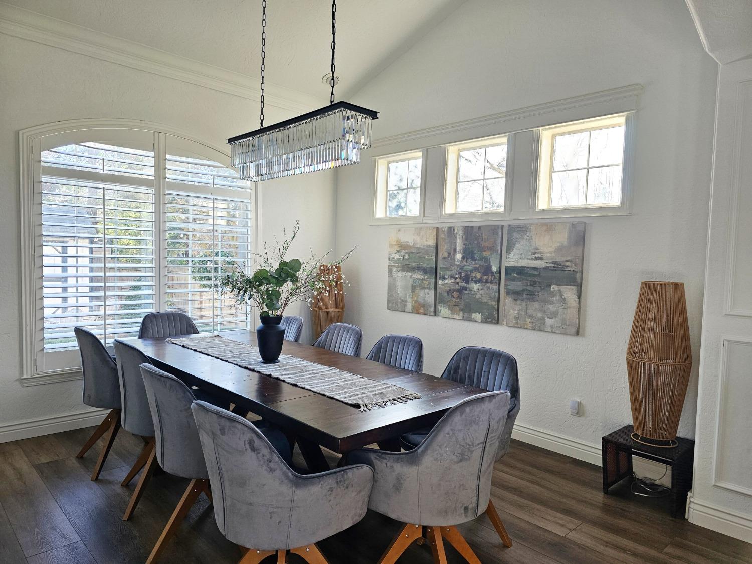 576 West Bedford Avenue Clovis, CA 93611 - Photo 14 of 79 a view of a dining room with furniture window and wooden floor