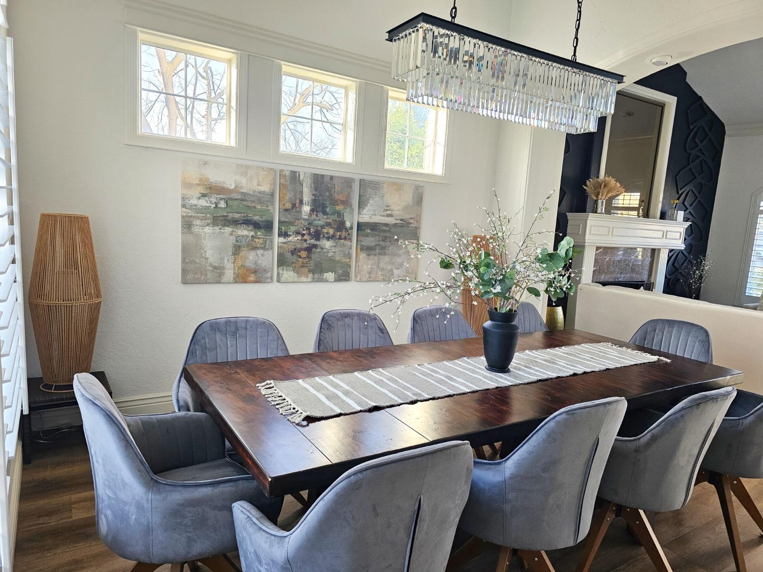 576 West Bedford Avenue Clovis, CA 93611 - Photo 15 of 79 a view of a dining room with furniture and a chandelier