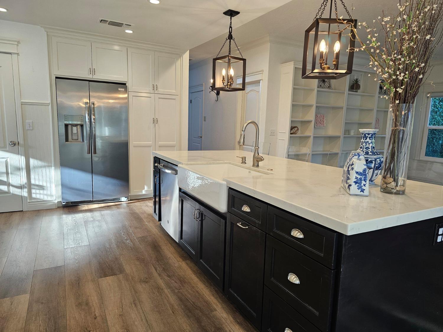 576 West Bedford Avenue Clovis, CA 93611 - Photo 19 of 79 a kitchen with stainless steel appliances a sink stove and refrigerator