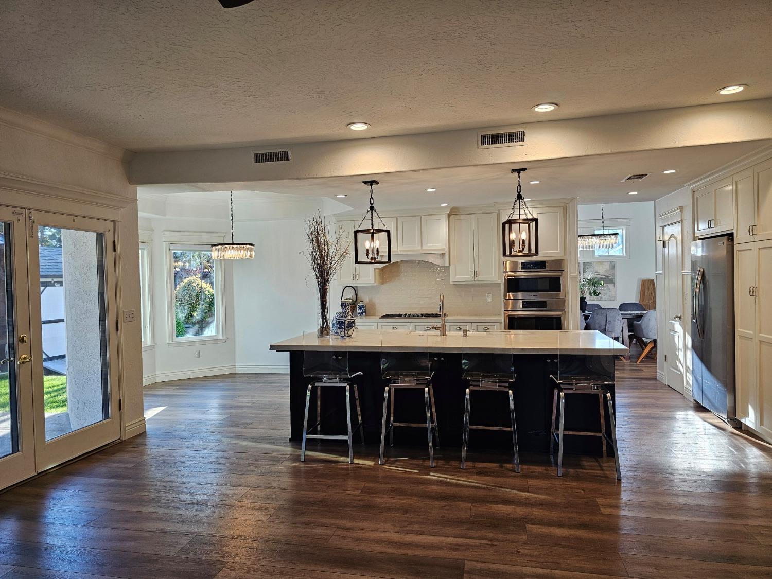 576 West Bedford Avenue Clovis, CA 93611 - Photo 27 of 79 a large kitchen with a table and chairs in it