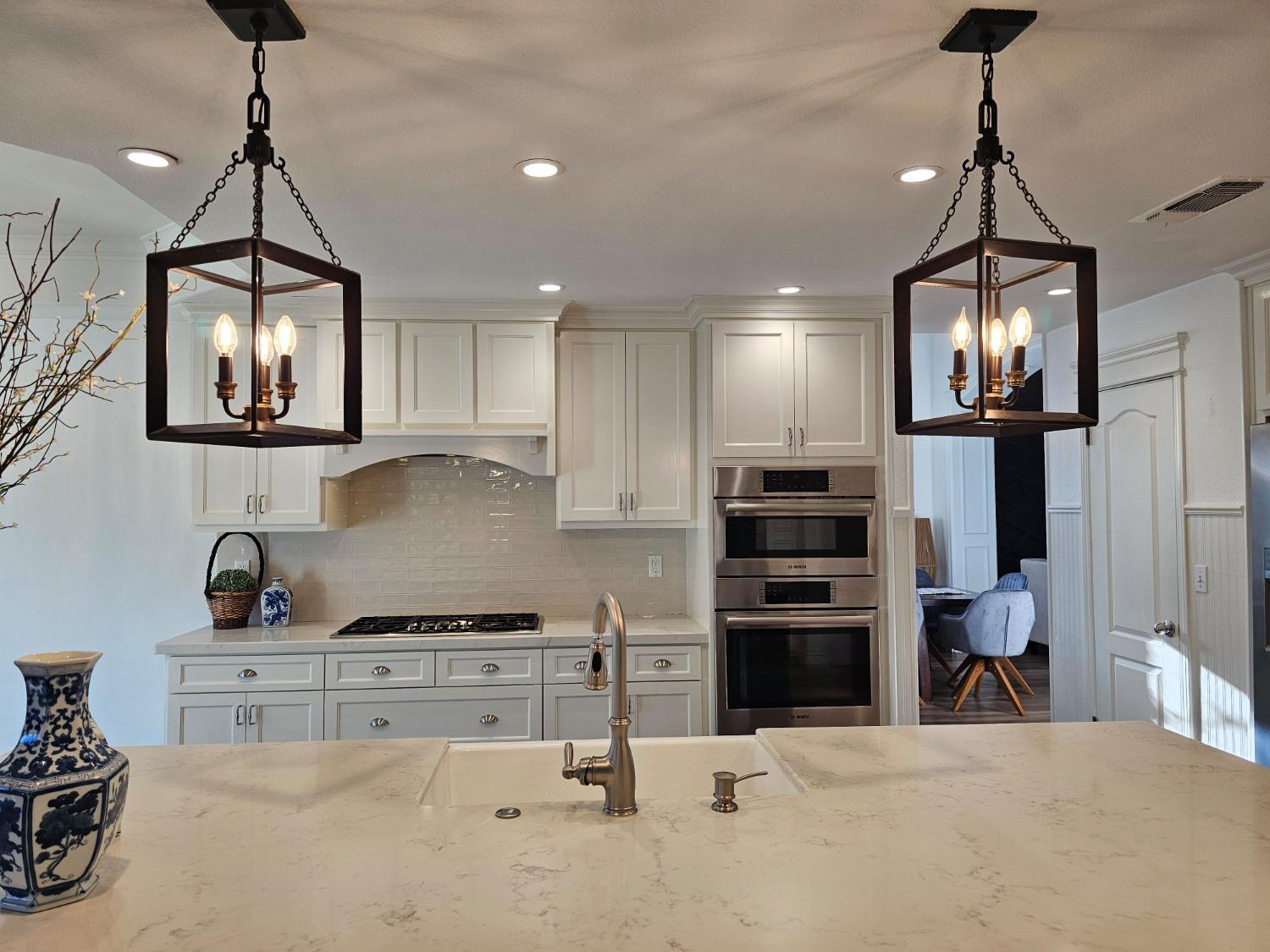 576 West Bedford Avenue Clovis, CA 93611 - Photo 28 of 79 a kitchen with stainless steel appliances granite countertop a stove and refrigerator
