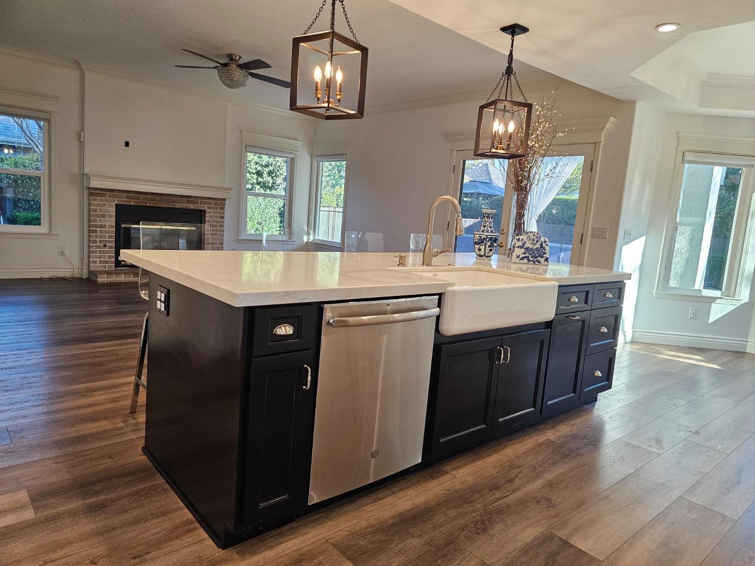 576 West Bedford Avenue Clovis, CA 93611 - Photo 29 of 79 a kitchen with kitchen island granite countertop a sink stainless steel appliances and cabinets