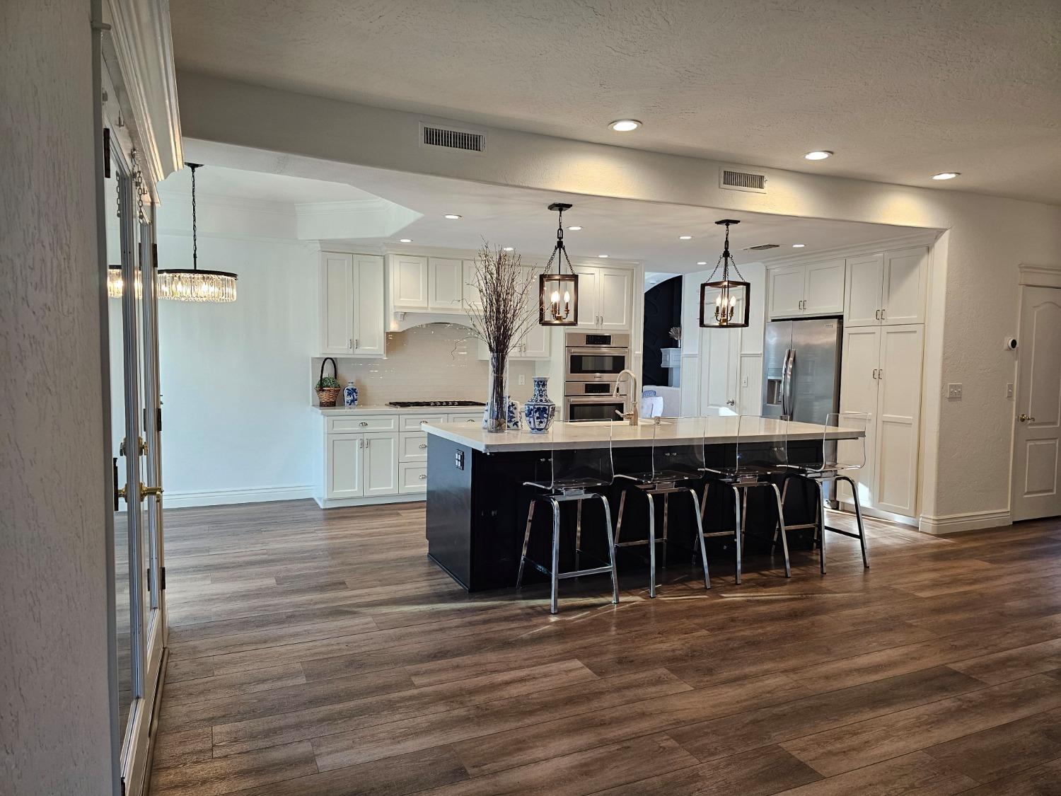 576 West Bedford Avenue Clovis, CA 93611 - Photo 33 of 79 a large kitchen with a table and chairs