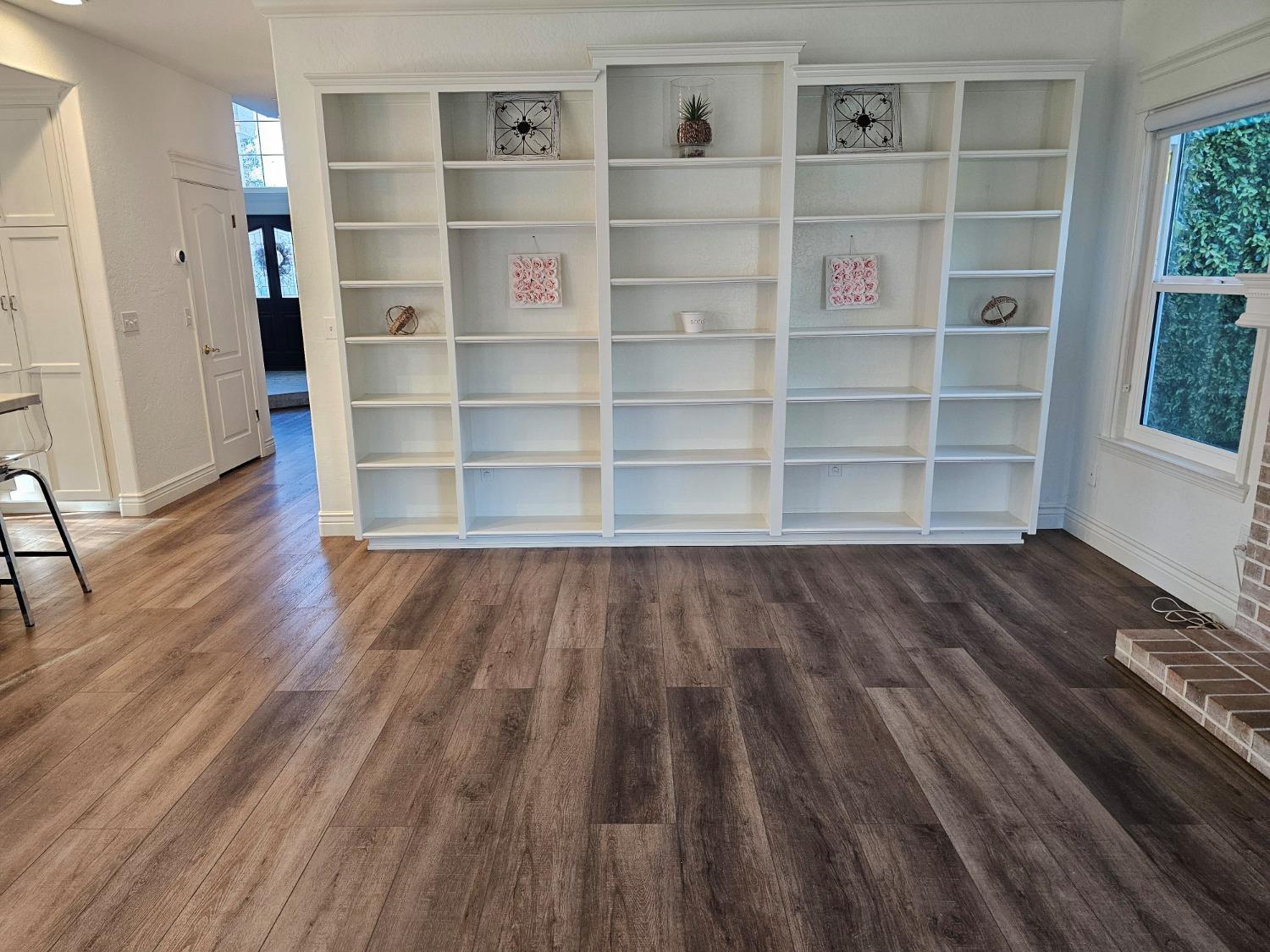 576 West Bedford Avenue Clovis, CA 93611 - Photo 38 of 79 a view of a room with wooden floor and closet