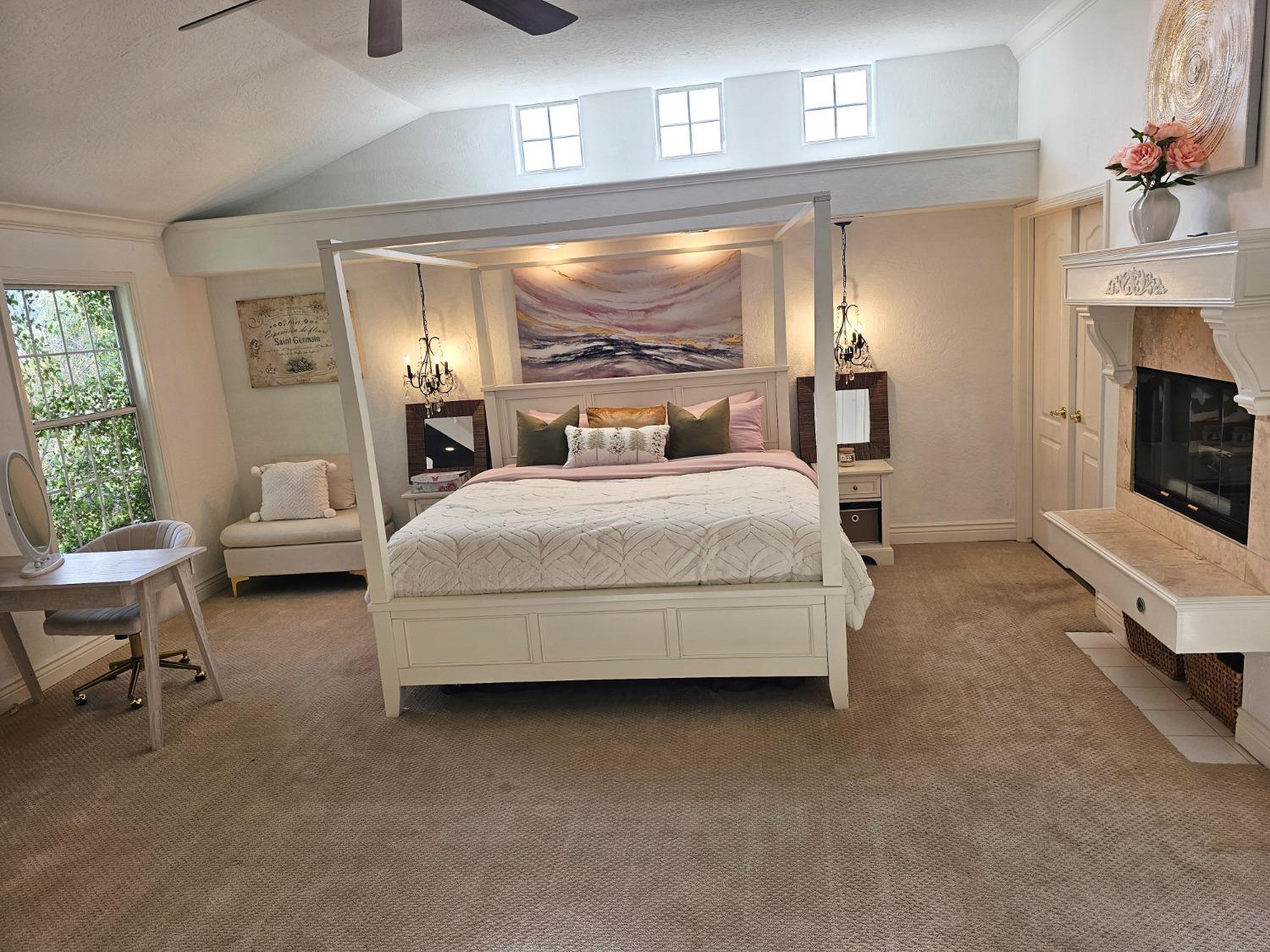 576 West Bedford Avenue Clovis, CA 93611 - Photo 44 of 79 a spacious bedroom with a bed and a fireplace