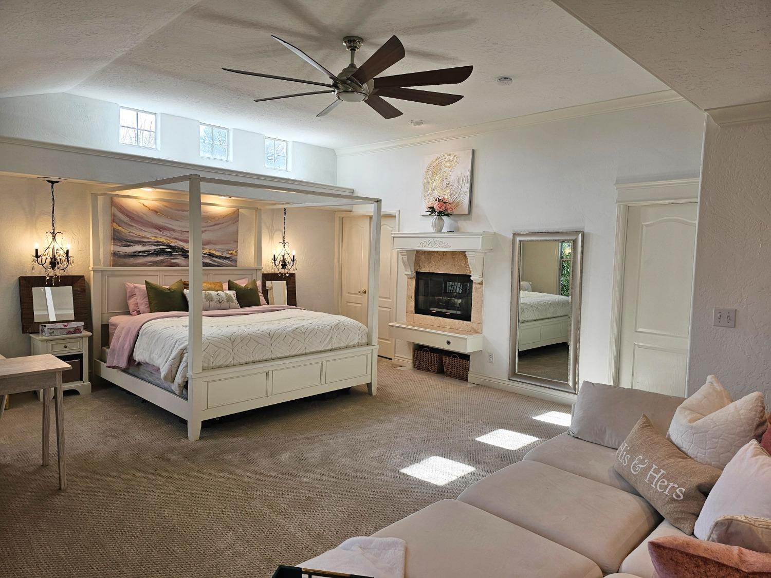 576 West Bedford Avenue Clovis, CA 93611 - Photo 46 of 79 a bedroom with a bed a couch and chandelier