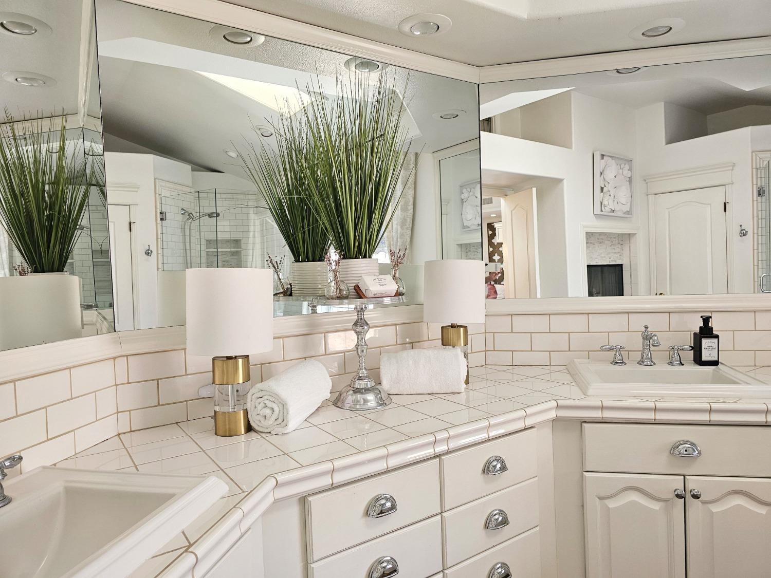 576 West Bedford Avenue Clovis, CA 93611 - Photo 47 of 79 a bathroom with double vanity sink a mirror and a shower