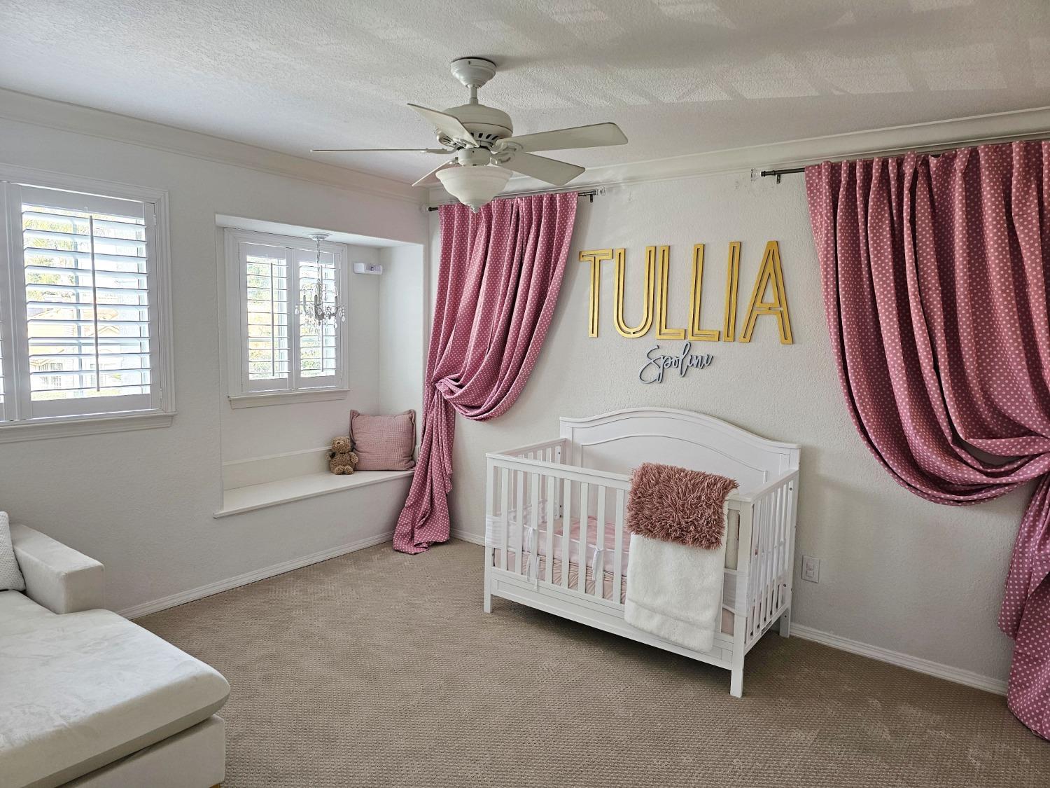 576 West Bedford Avenue Clovis, CA 93611 - Photo 56 of 79 a bedroom with a bed and a chandelier