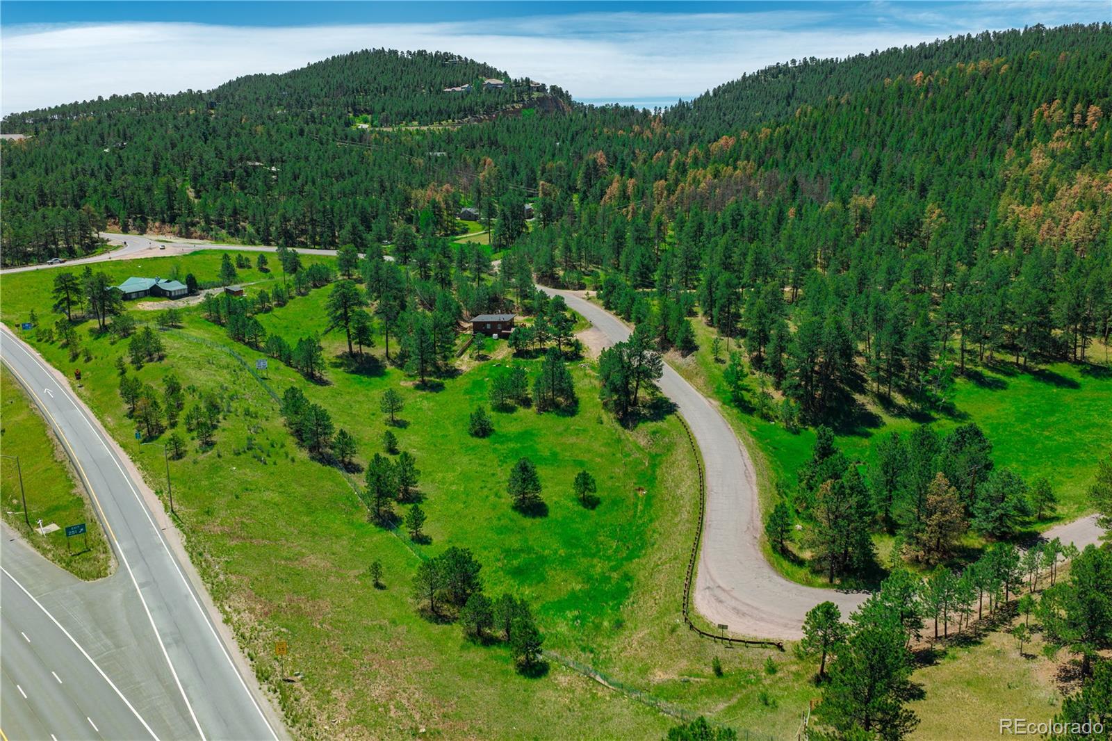 29793 Ruby Ranch Road Evergreen, CO 80439 - Photo 10 of 28 a view of a garden with a houses