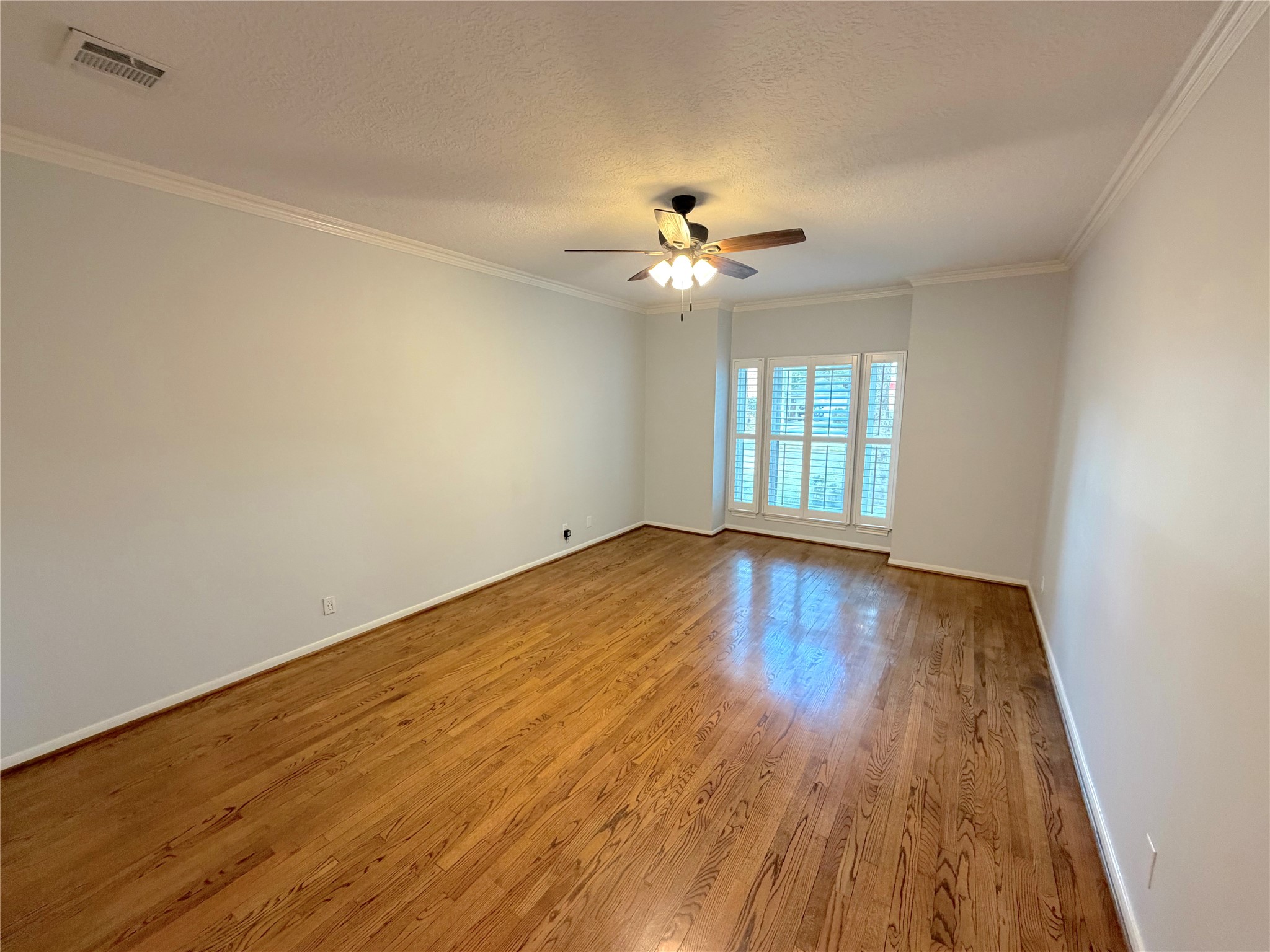 20723 Trellis Lane Houston, TX 77073 - Photo 13 of 29 wooden floor in an empty room with a window