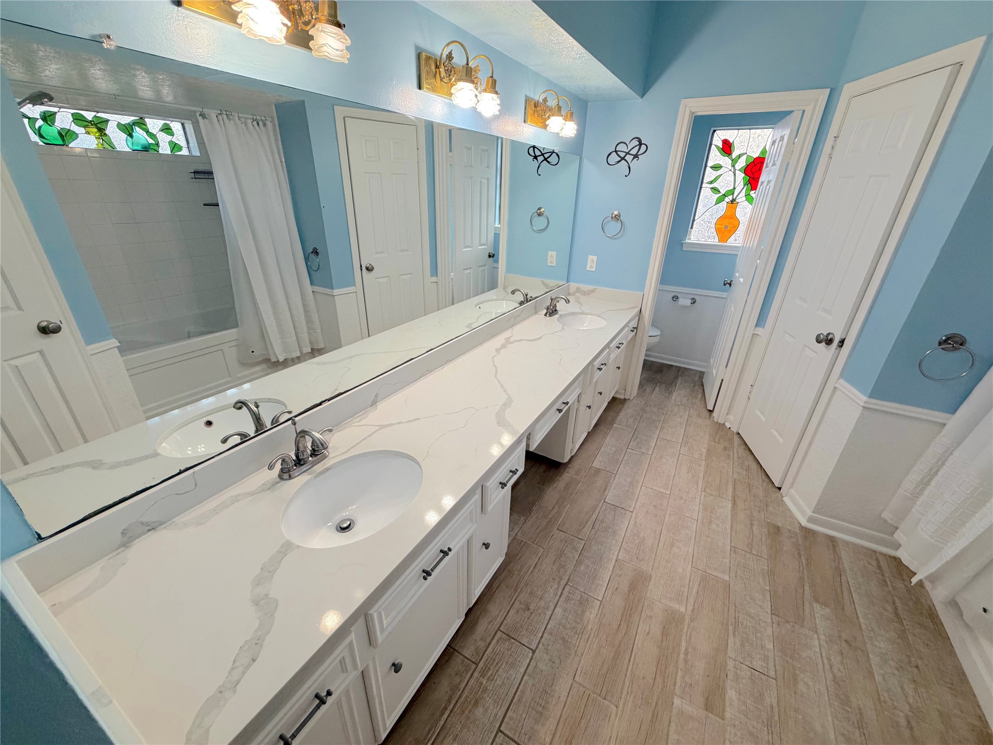 20723 Trellis Lane Houston, TX 77073 - Photo 15 of 29 a spacious bathroom with a double vanity sink and a mirror