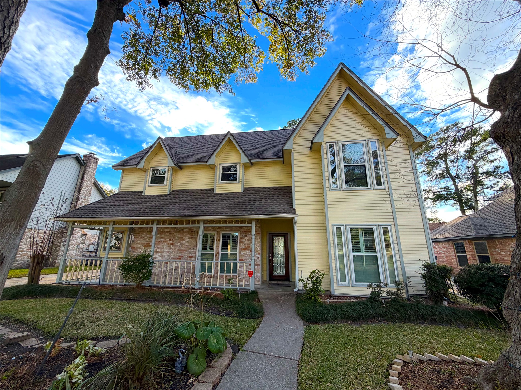 20723 Trellis Lane Houston, TX 77073 - Photo 2 of 29 a front view of a house with a yard