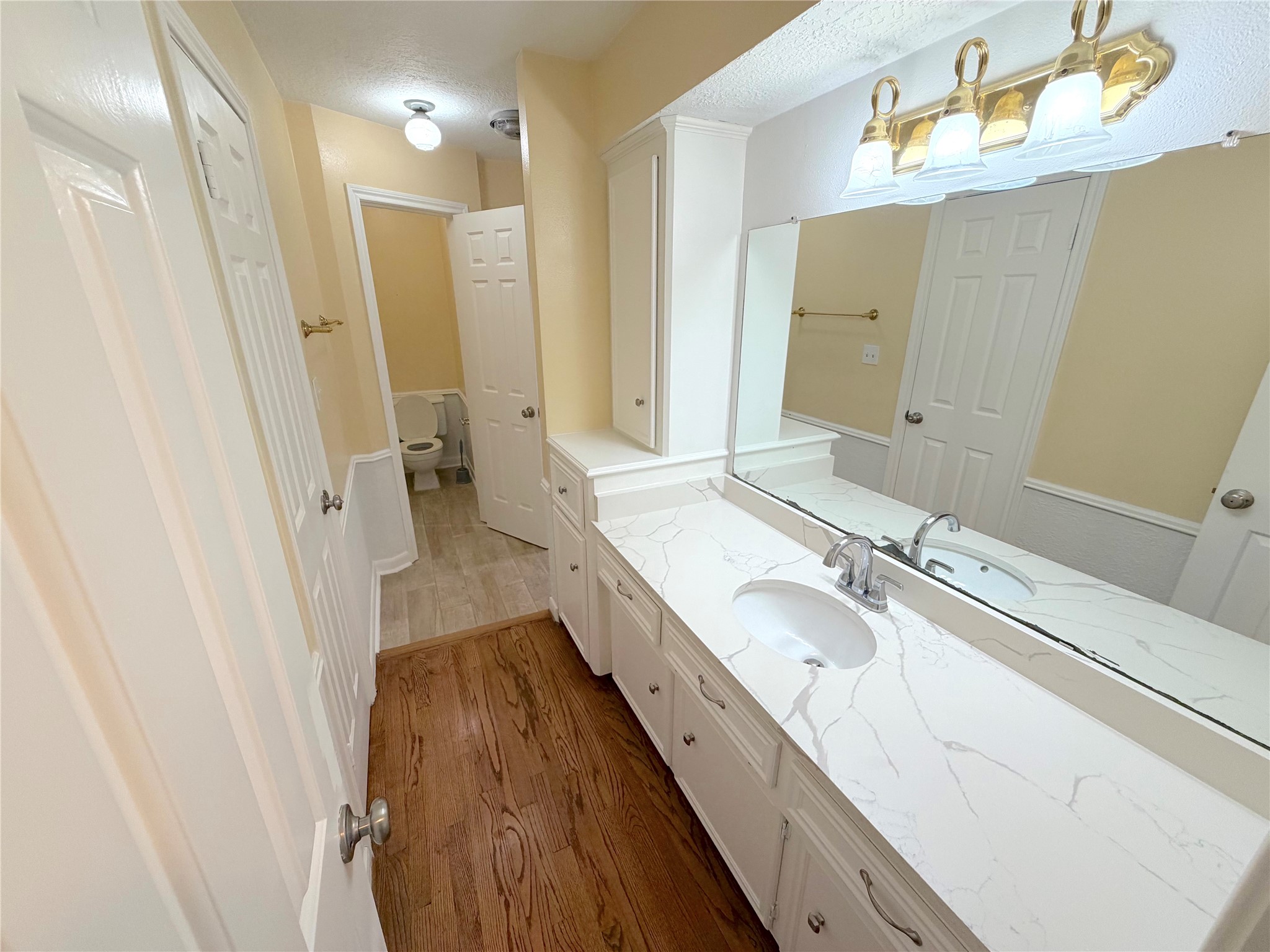 20723 Trellis Lane Houston, TX 77073 - Photo 23 of 29 a bathroom with a granite countertop sink a mirror and shower