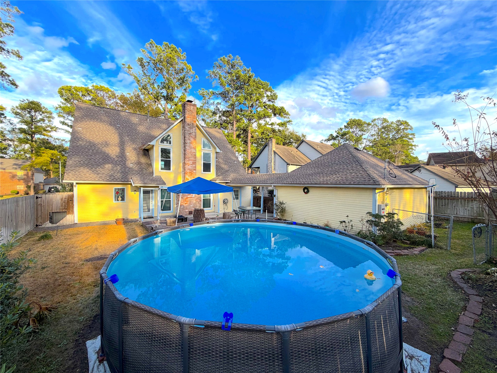 20723 Trellis Lane Houston, TX 77073 - Photo 27 of 29 a view of a patio with table and chairs under an umbrella