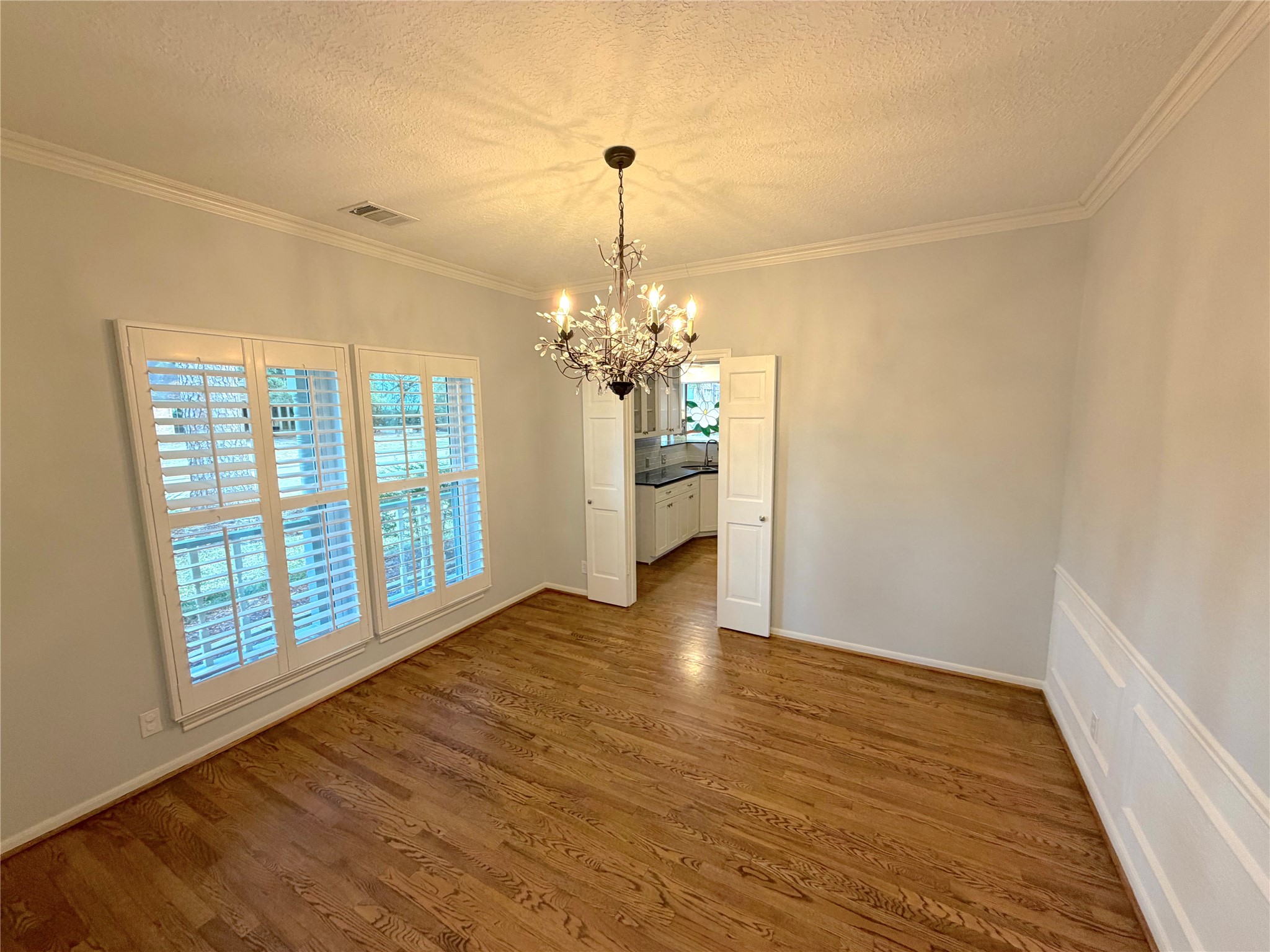 20723 Trellis Lane Houston, TX 77073 - Photo 6 of 29 a view of an empty room with window and wooden floor