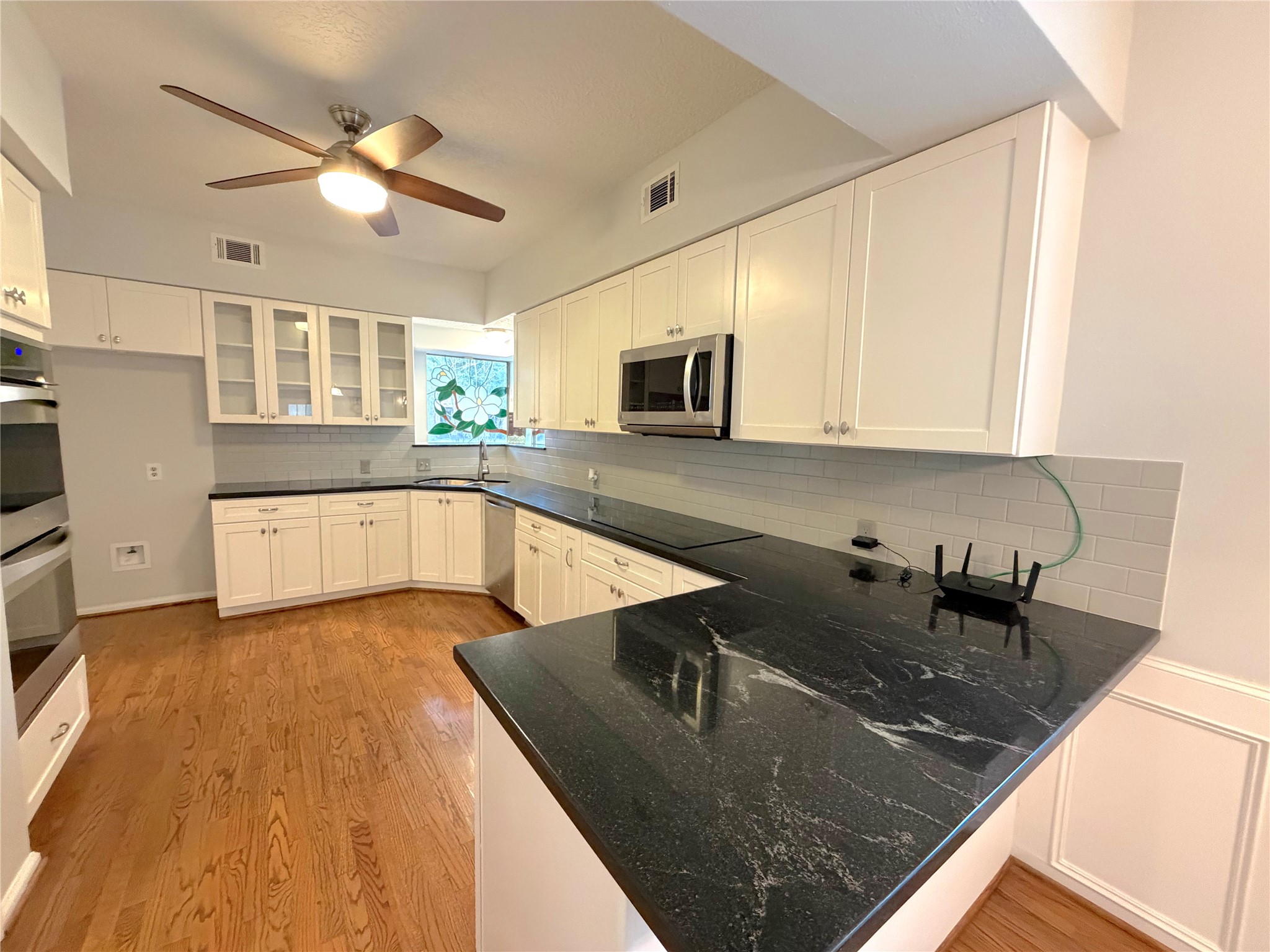 20723 Trellis Lane Houston, TX 77073 - Photo 7 of 29 a kitchen with stainless steel appliances granite countertop a sink a stove counter space and cabinets