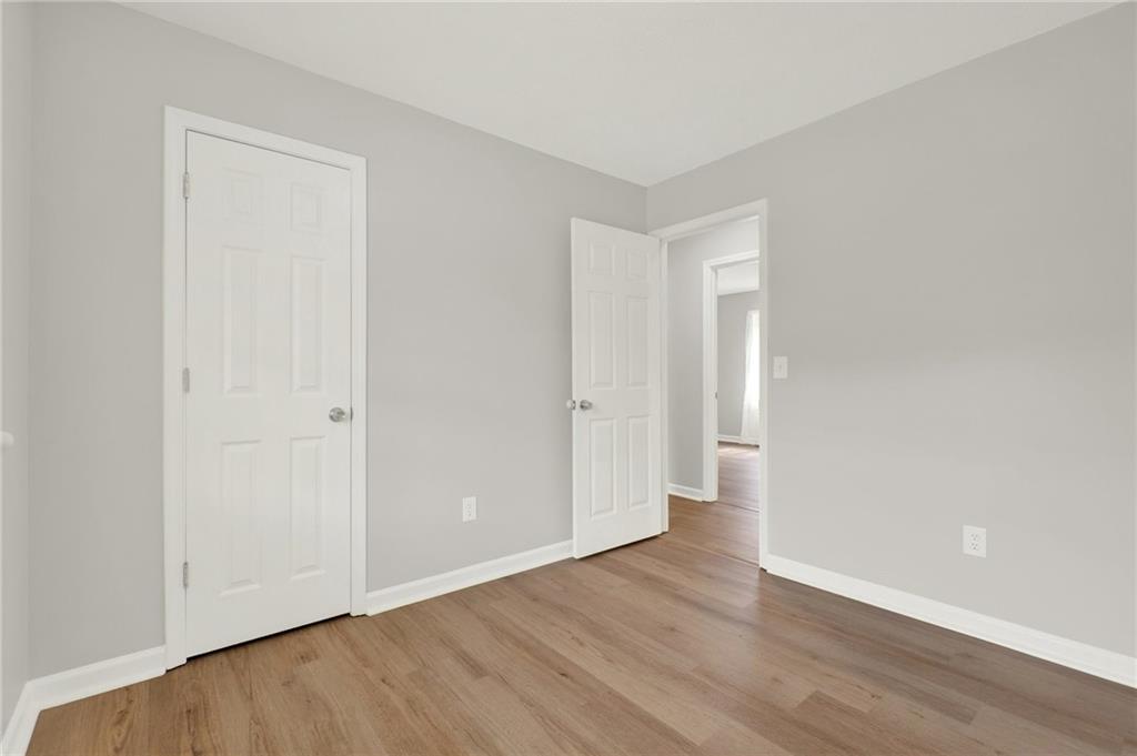 76 Picklesimer Road Southwest Cartersville, GA 30120 - Photo 23 of 43 a view of an empty room with wooden floor