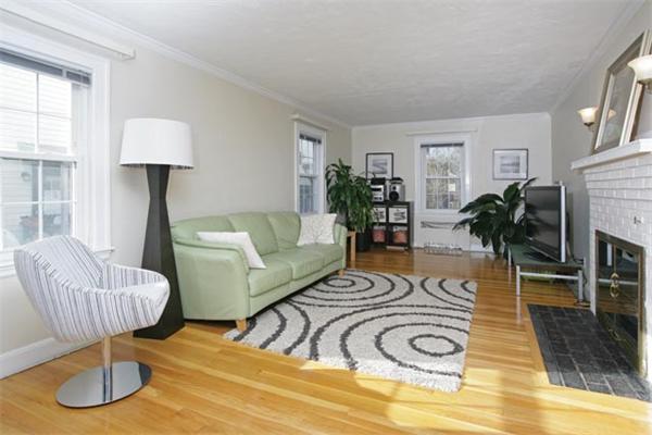 69 Falmouth Road Newton, MA 02465 - Photo 2 of 5 a living room with furniture and a chandelier