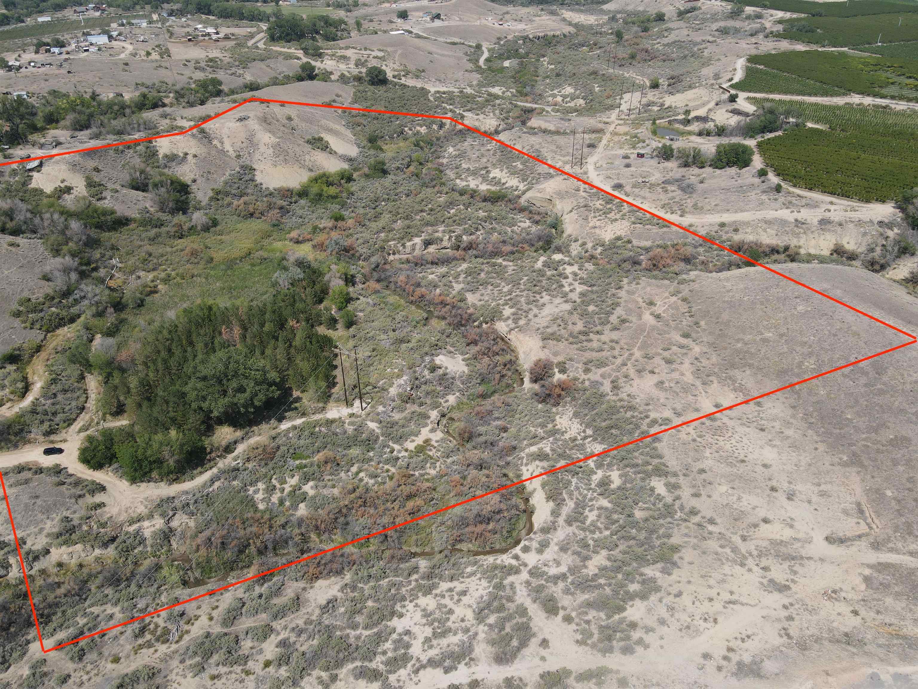 Tbd D Road Palisade, CO 81526 - Photo 3 of 11 a view of a dry yard with wooden fence
