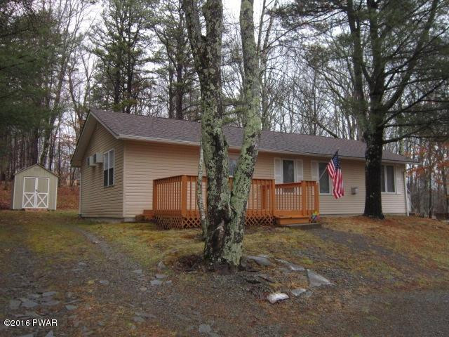 203 Westcolang Road Lackawaxen, PA 18435 - Photo 1 of 15 a view of a house with large tree next to a yard