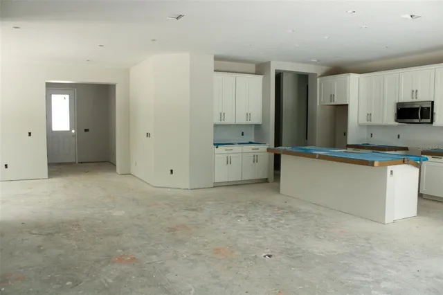 a view of a kitchen with a sink