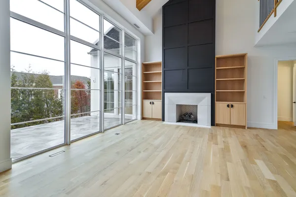 a view of empty room with floor and fireplace