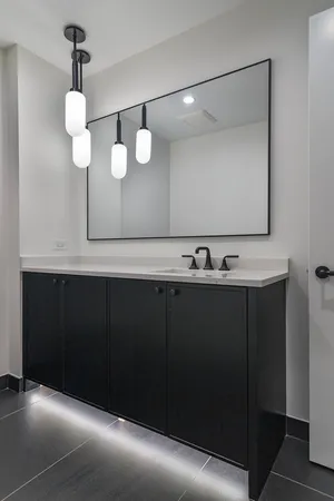 a bathroom with a glass shower door