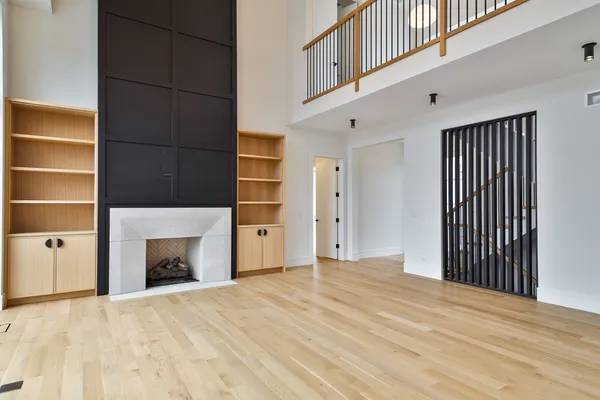 a view of empty room with a fireplace and cabinet