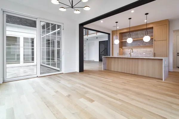 en view interior of the house with wooden floor and fan