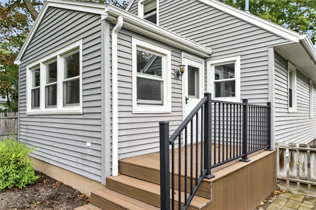 295 Penhurst Road Brighton, NY 14610 - Photo 40 of 42 Newer trex decking, and railing lead to the back o